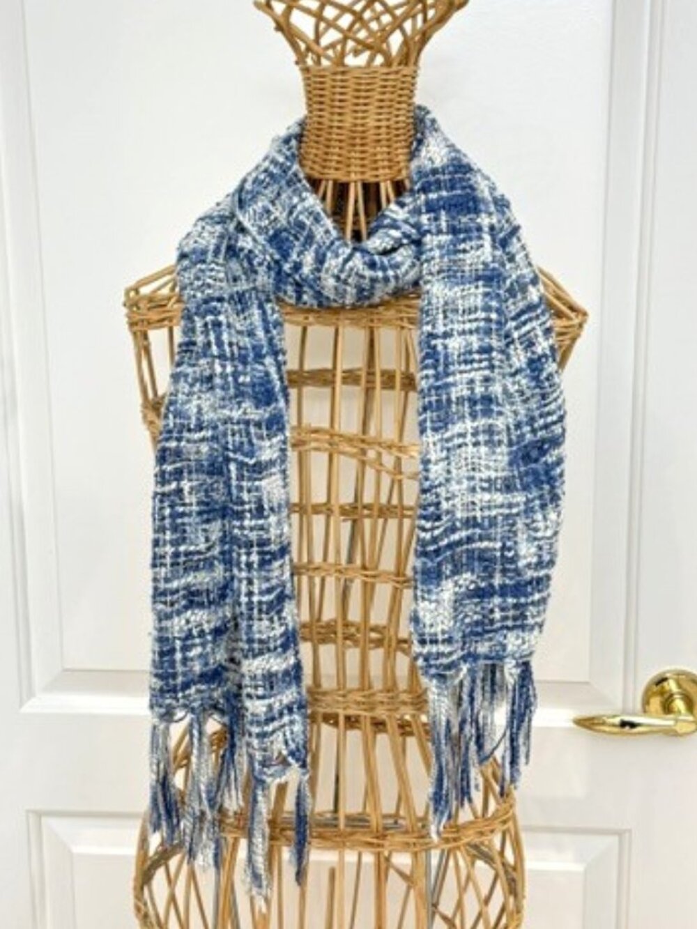 Blue and white boucle knit oblong scarf.
